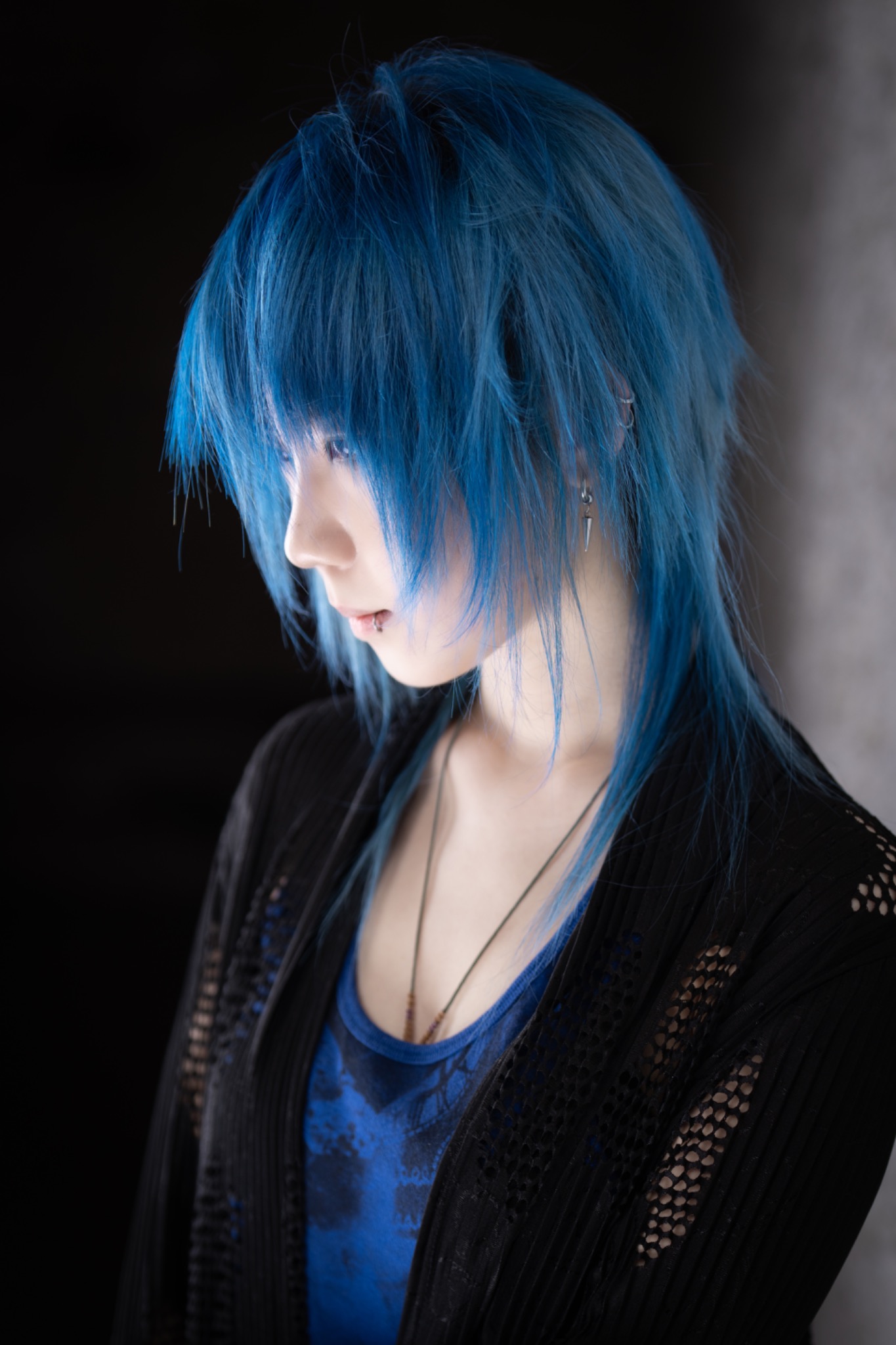Vivid blue layered haircut in side profile