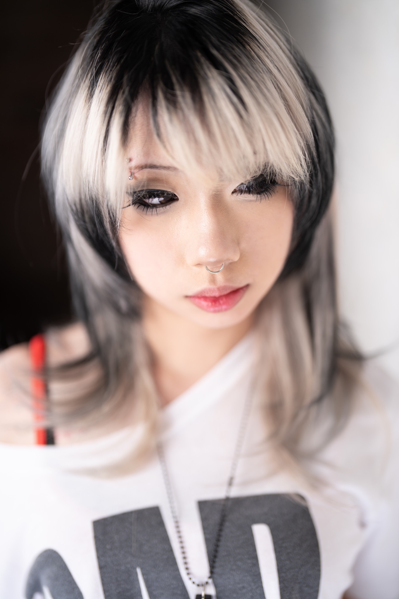Kenn black and platinum split-colour layered haircut portrait
