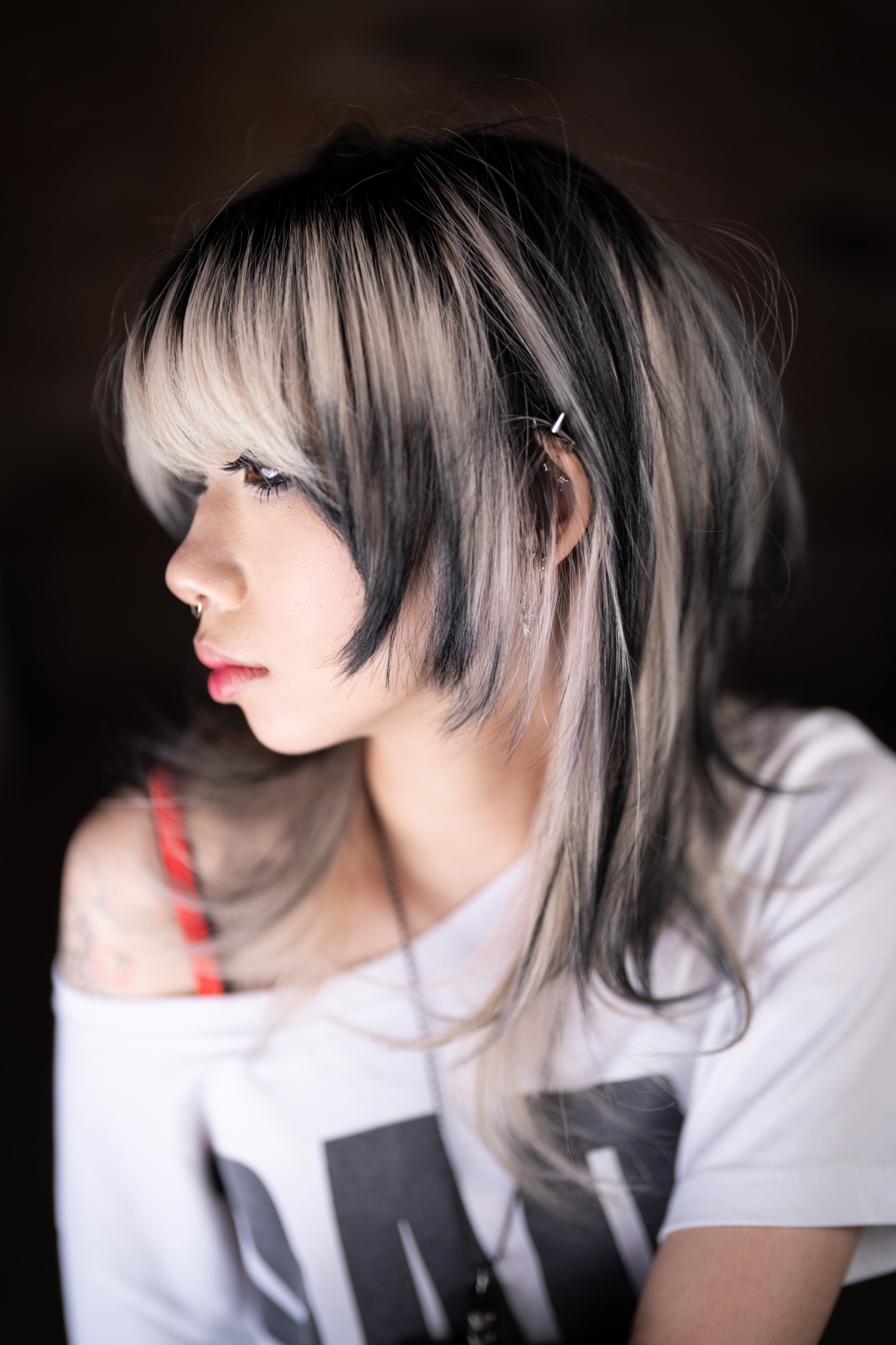 Portrait showing a layered Wolf Cut